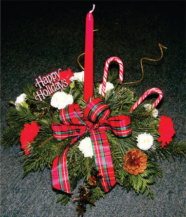 XC 1152 Christmas centrepiece with flowers, greens and candle.
